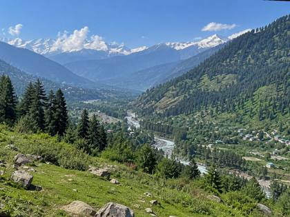 Green valley and snowy peaks
